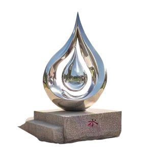 Stainless steel drop-shaped sculpture symbolizing growth