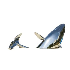 Stainless steel whale sculpture breaching from the ocean – outdoor public art