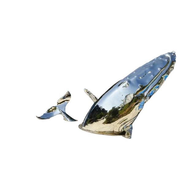 Stainless steel whale sculpture breaching from the ocean – outdoor public art