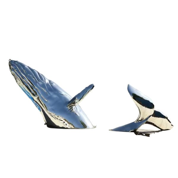 Stainless steel whale sculpture breaching from the ocean – outdoor public art