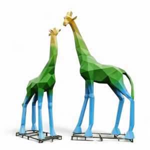 Colorful geometric fiberglass giraffe sculpture in yellow, green, and blue gradient tones.