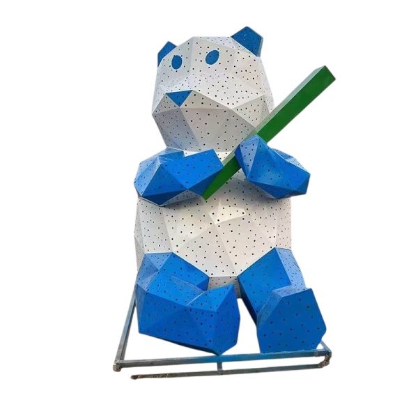 Blue and white geometric panda sculpture holding bamboo for outdoor display.