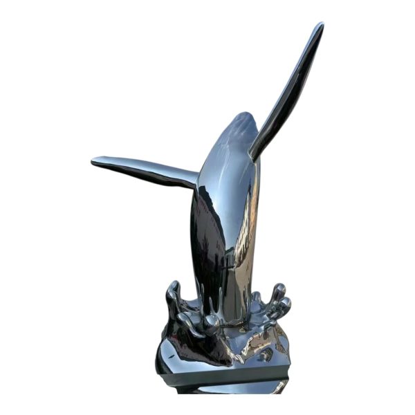 A stainless steel sculpture of a whale interacting with a little girl, polished to a mirror finish, suitable for outdoor display.