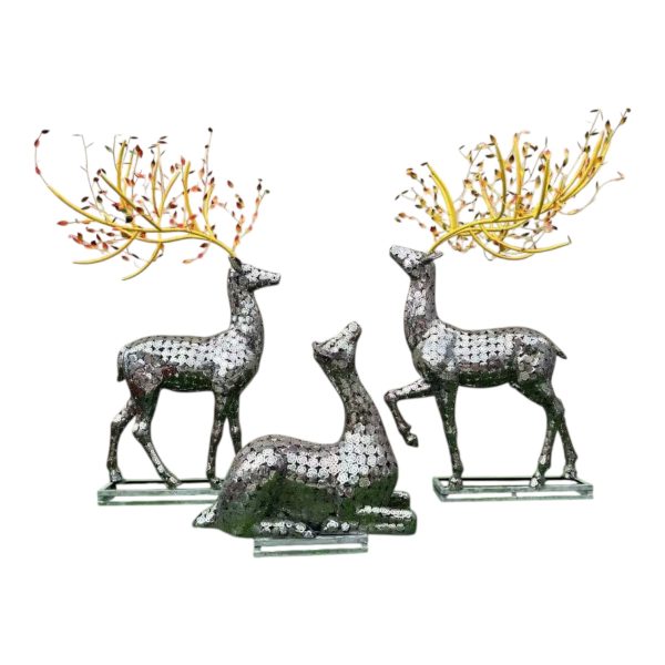 Pair of stainless steel deer sculptures with decorative golden antlers for outdoor display.