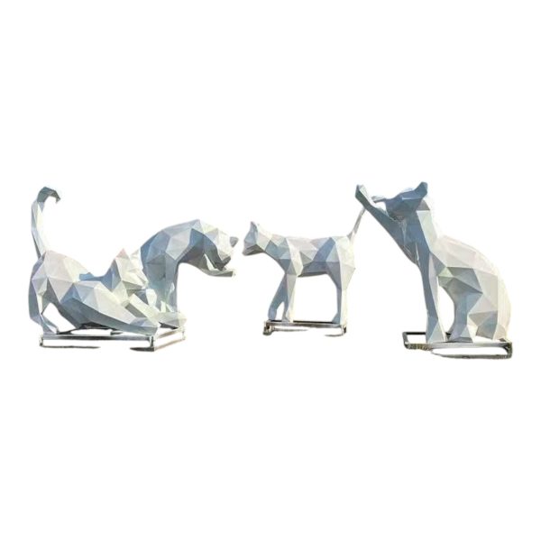 Two stainless steel geometric cat sculptures in playful poses for modern decoration.
