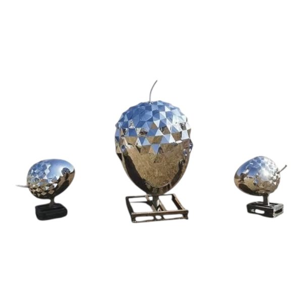 Stainless steel handbag sculpture with a polished mirror finish, ideal for fashion or art display.