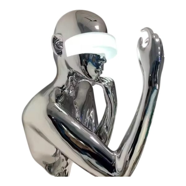 Contemporary stainless steel figure sculpture with reflective finish, designed for art installations. ﻿