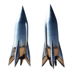 Stainless steel rocket sculptures with a smooth, polished surface and pointed tops