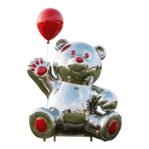 Stainless steel bear sculpture holding a red heart-shaped balloon